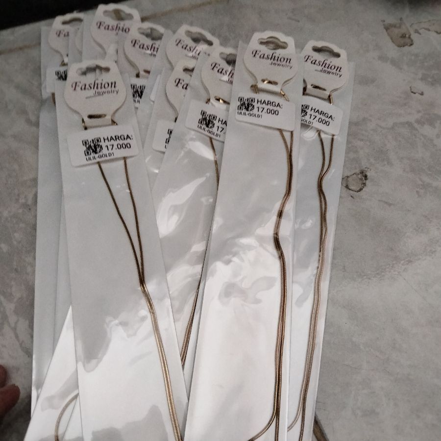 kalung titanium gold