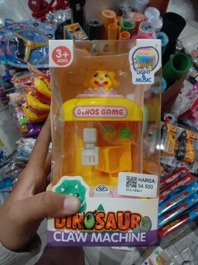 Mainan dinosaurus claw machine